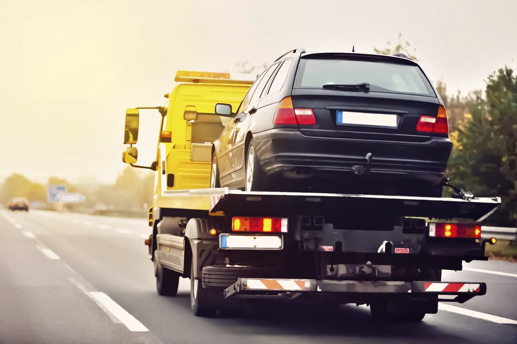 Transportar coche en grúa precio en Marín